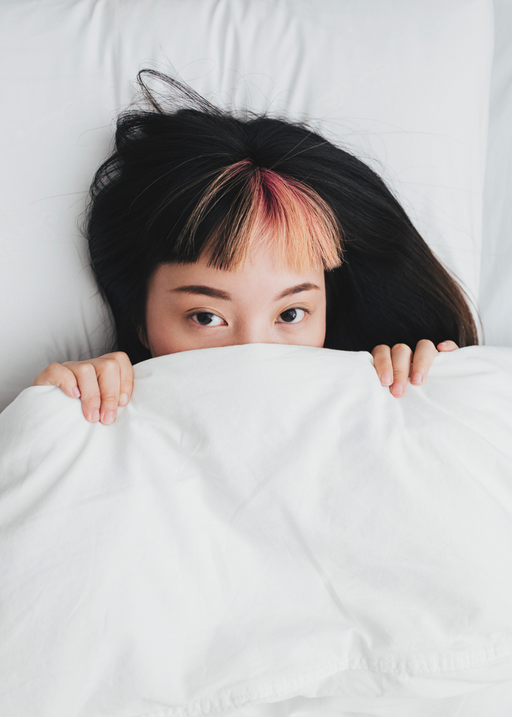 woman in bed trying to sleep