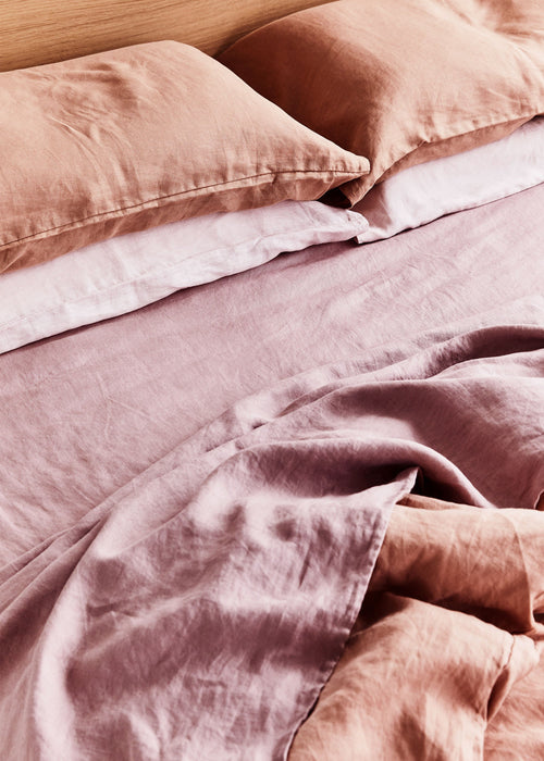 linen bed sheets in orange and pink