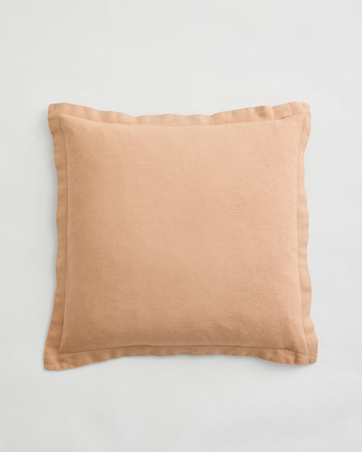 The Bed Threads Terracotta 100% French Flax Linen Cushion Cover is a square cushion cover in a light brown shade, featuring a subtle border, shown against a plain white background.