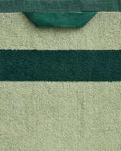 The Bed Threads Forest & Sage Two-Toned 100% Cotton Terry Bath Sheet features textured green cotton, a dark green central stripe, a top fabric loop, and a quick-drying design—ideal for luxury towel enthusiasts. - view
