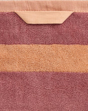 A close-up of the Bed Threads Terracotta & Pink Clay Two-Toned 100% Cotton Terry Bath Towel, crafted from 650GSM terry with a horizontal pink stripe on terracotta and finished with a color-matched hanging loop. - view